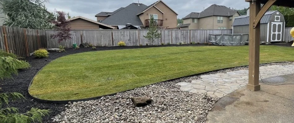 Backyard in Gresham, OR, with new sod and landscaping.