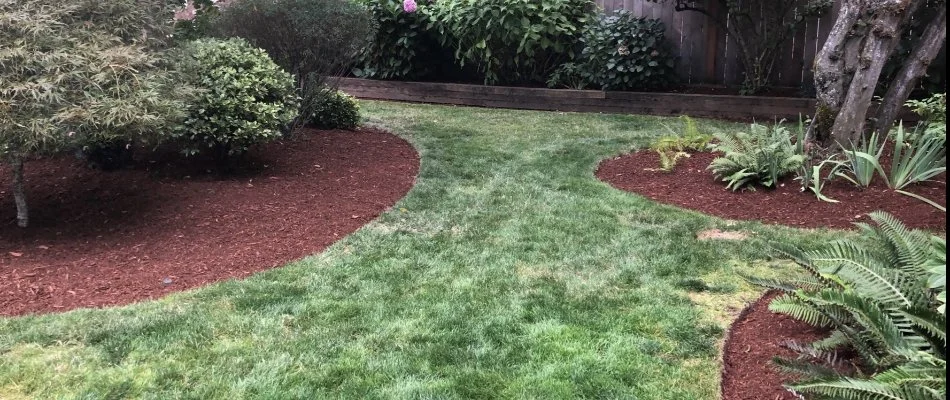 Refreshed mulch bed on residential property in Gresham, OR.