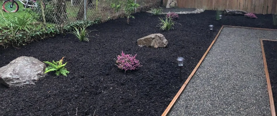 Walkway and mulched landscape in Gresham, OR, with plants.