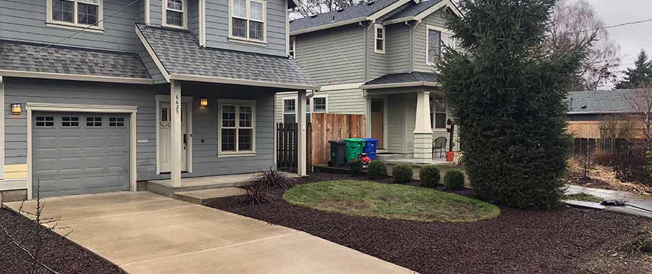 Dark mulch landscaping at a home in Troutdale, OR.