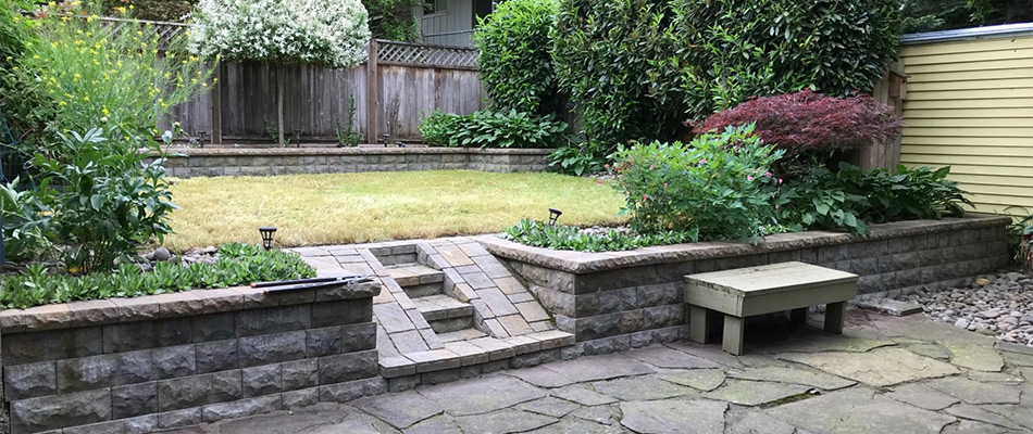 Outdoor steps that connect from the patio to the yard in a customer's backyard in Gladstone, OR.