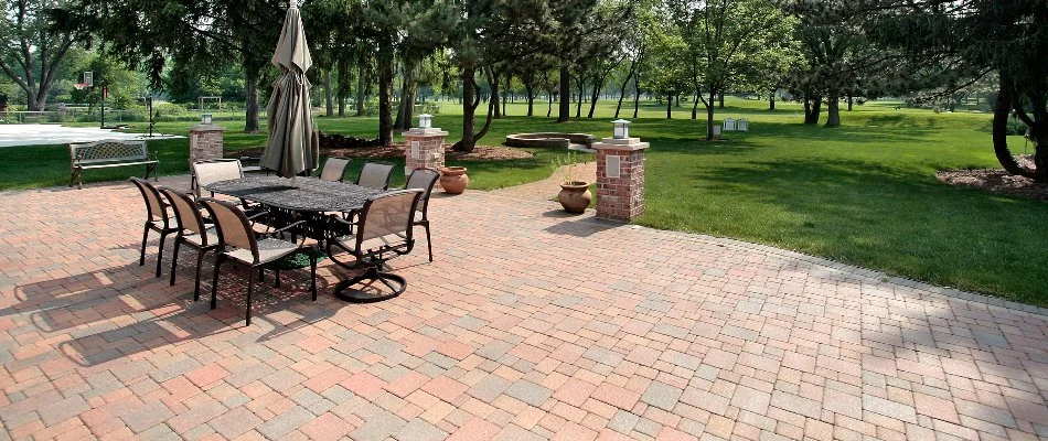 A paver patio in Jennings Lodge, OR, with a table and seats.