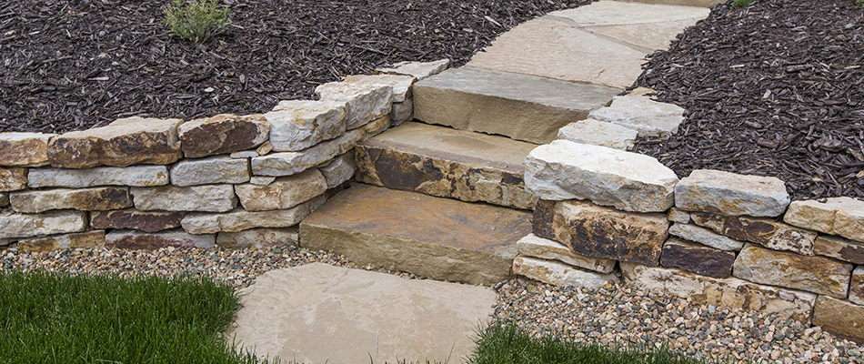Retaining wall separated by stone outdoor steps in Clackamas, OR.
