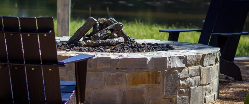 Wood-burning stone fire pit with seating in Boring, OR.